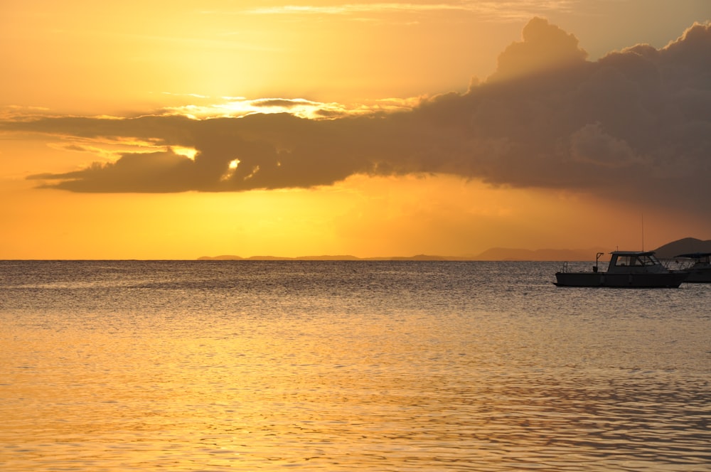 a boat floating on top of a large body of water