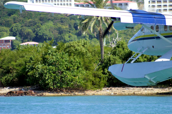 a small plane sitting on top of a body of water