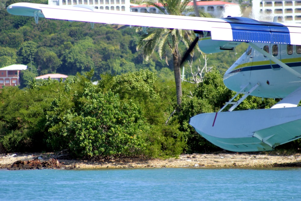 a small plane sitting on top of a body of water