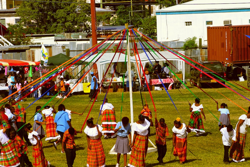 a group of people standing around a tent