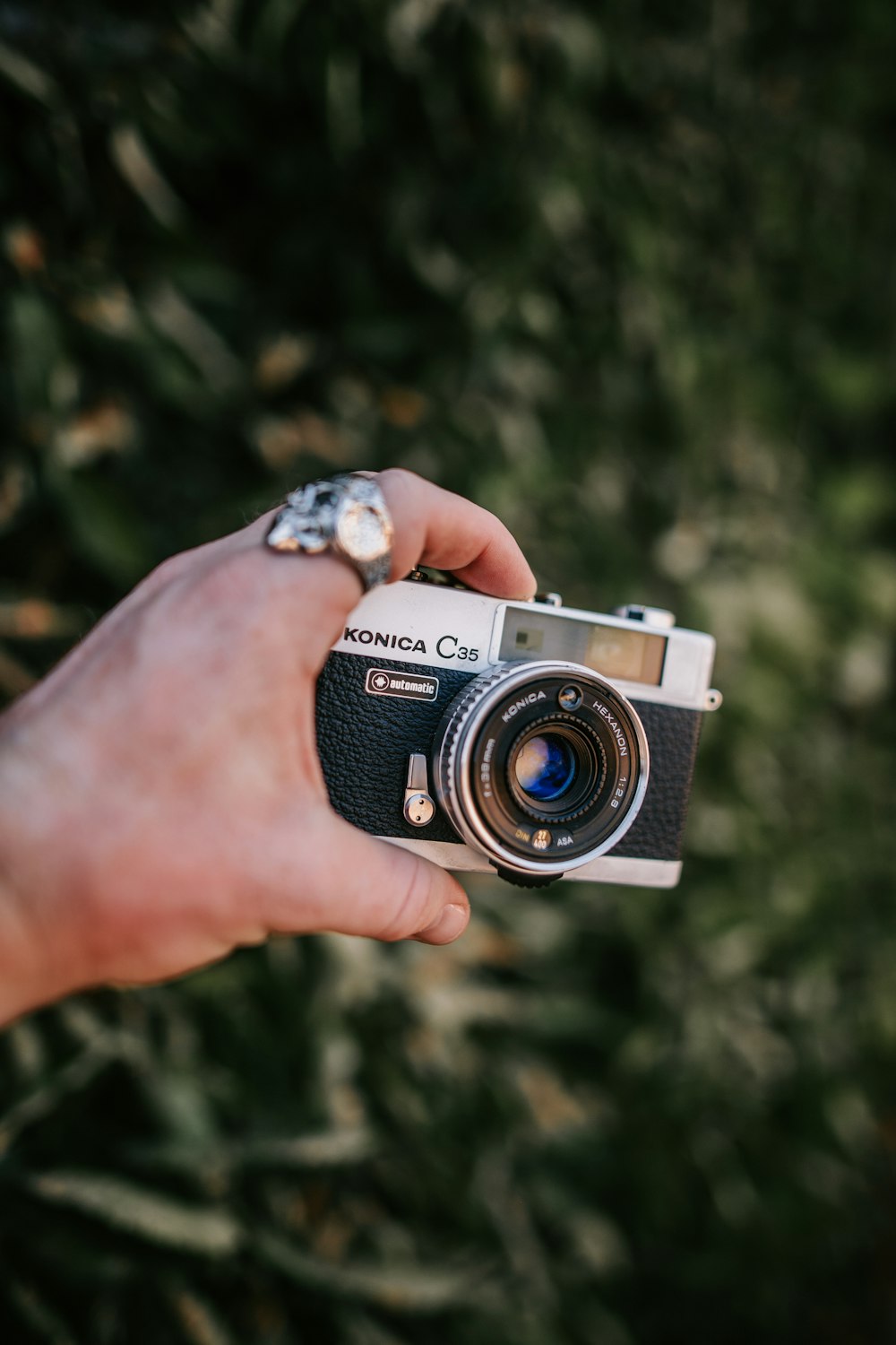 a person holding a camera in their hand