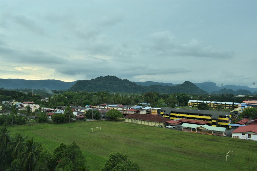 a view of a town with mountains in the background