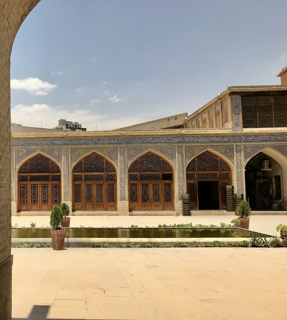 a large building with a fountain in front of it