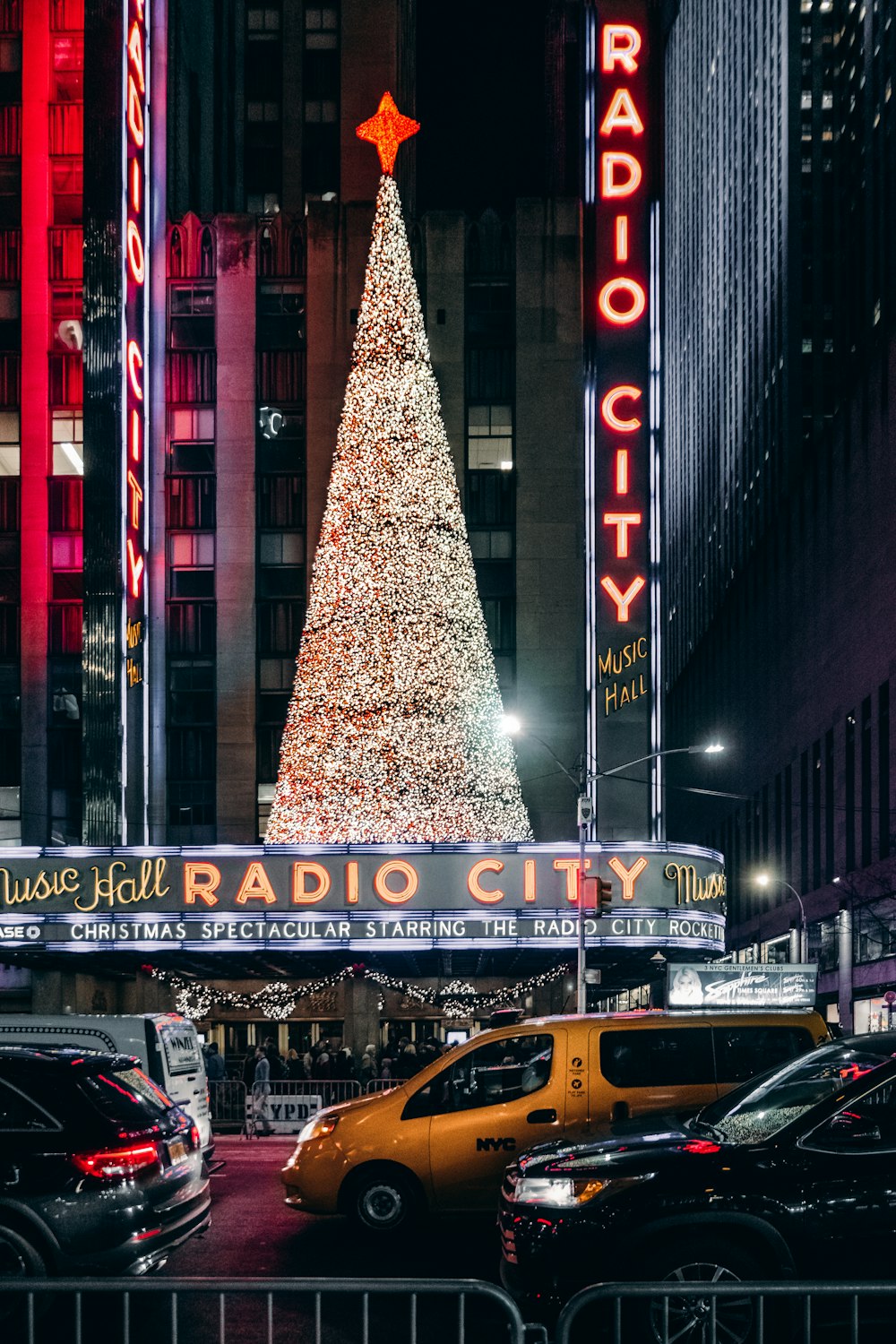 a radio city christmas tree in the middle of a city