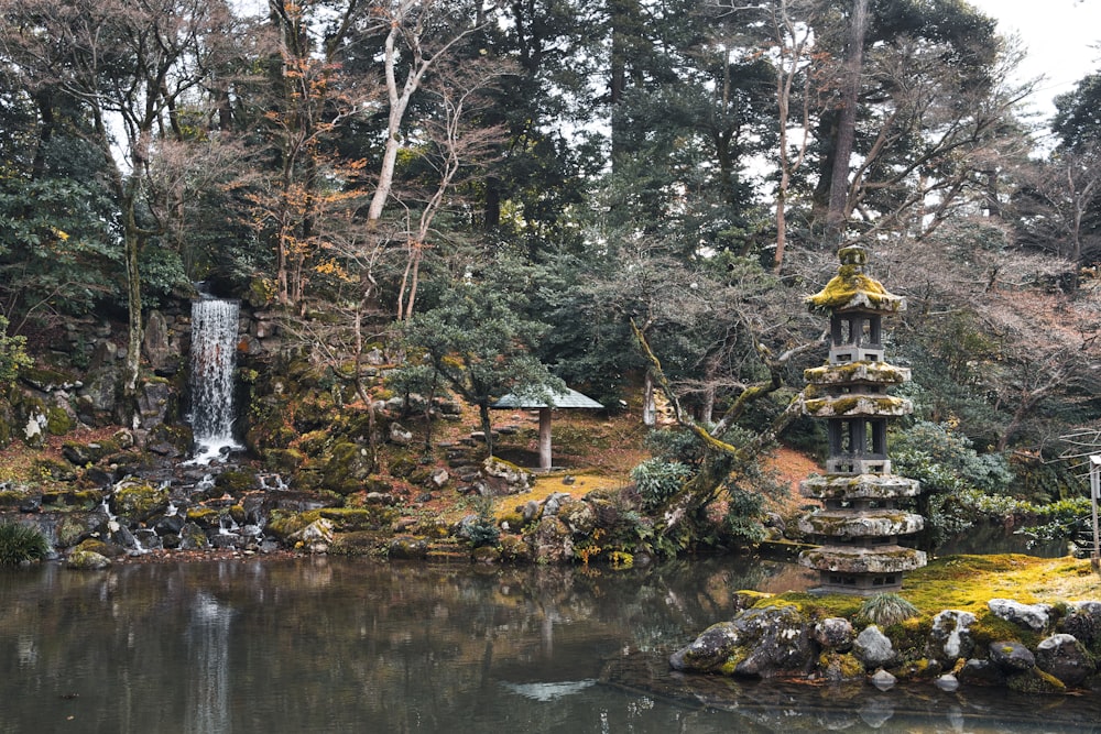 a pond with a waterfall in the middle of it