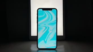 A sleek smartphone glowing with neon blue and purple light, displaying a voice wave interface.