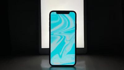 Smart devices with glowing screens displayed on a futuristic gradient yellow background.