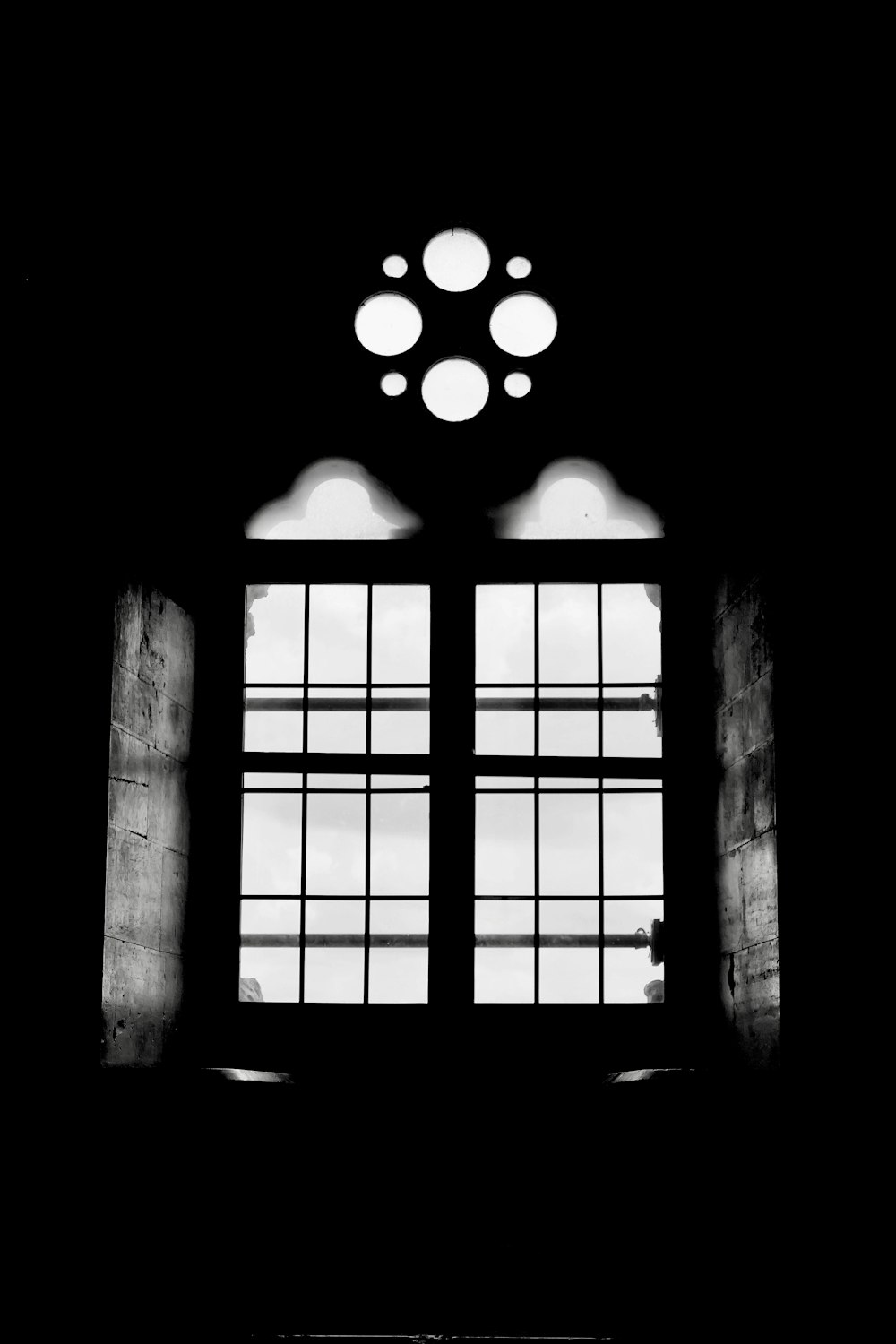 a black and white photo of an open window