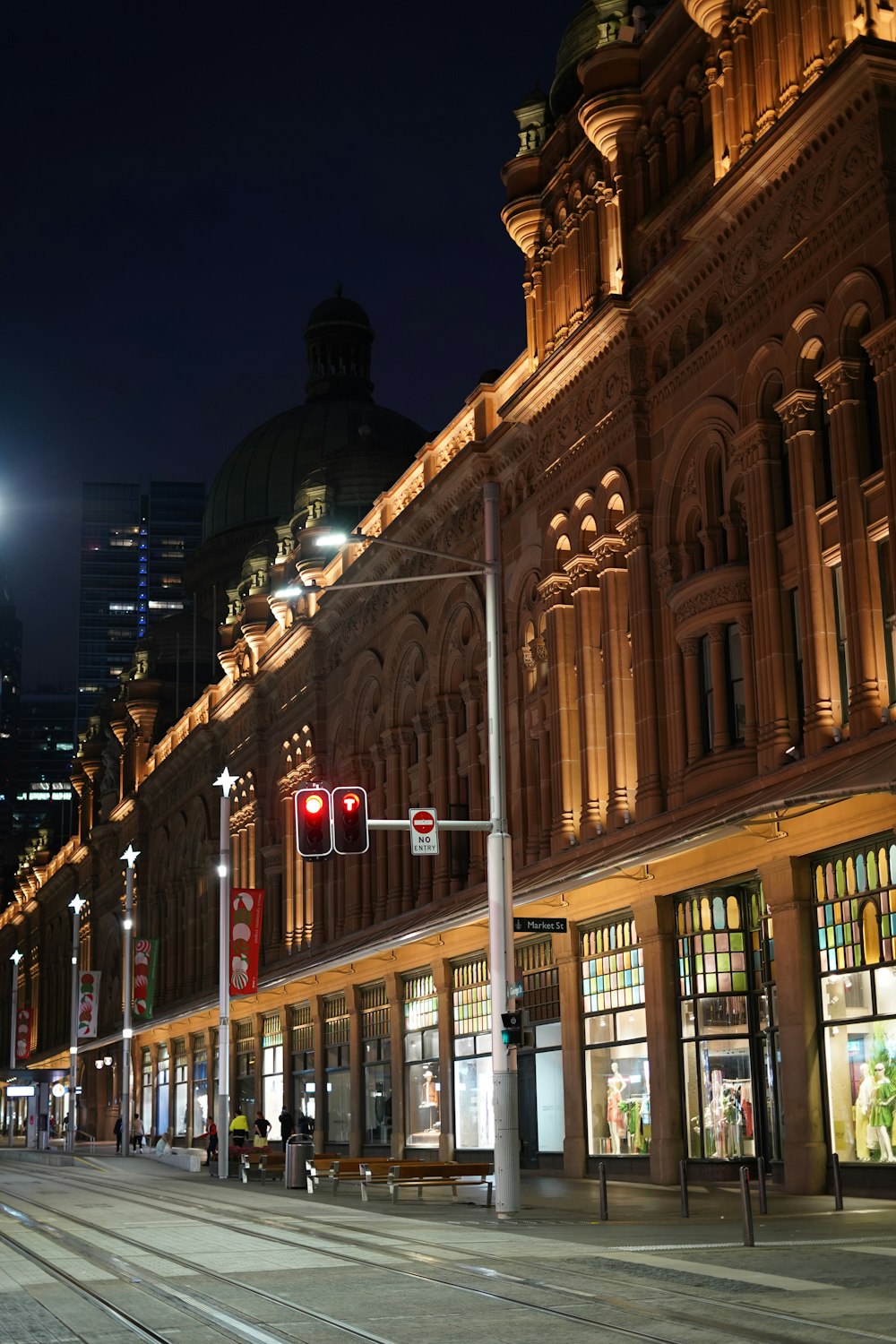 a city street at night with a traffic light