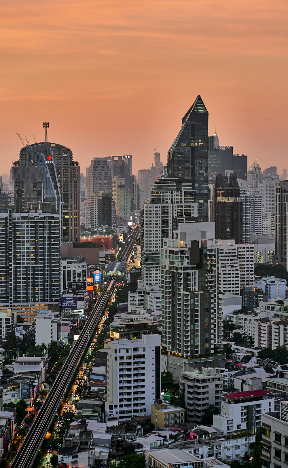 a view of a city at dusk from a high rise