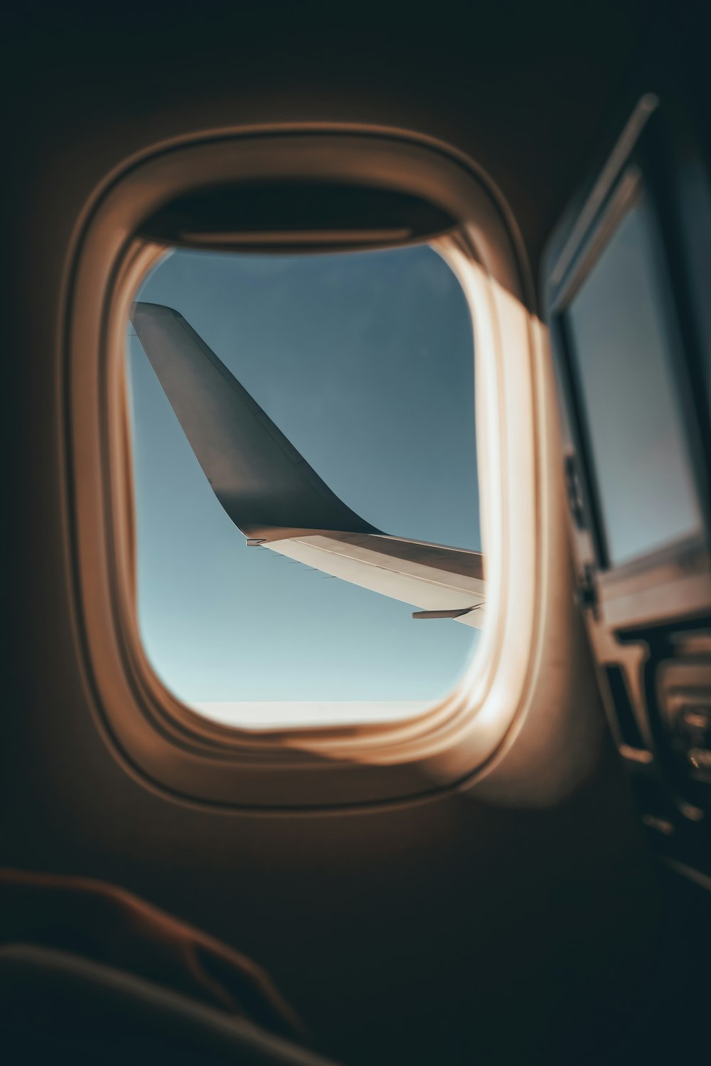 a view of the wing of an airplane through a window