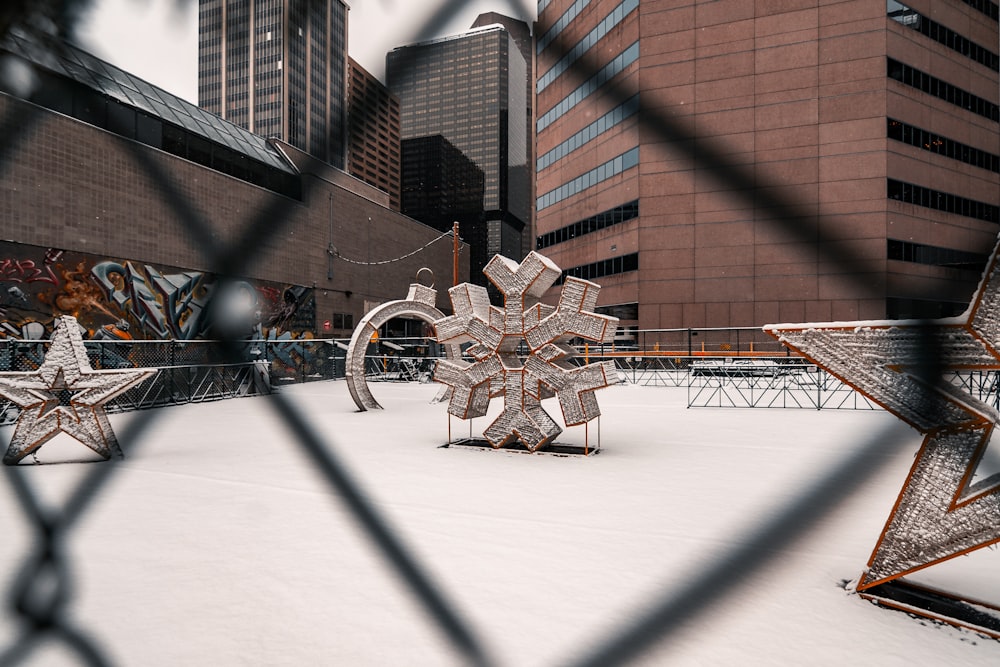 a snow covered roof with a snowflake in the foreground