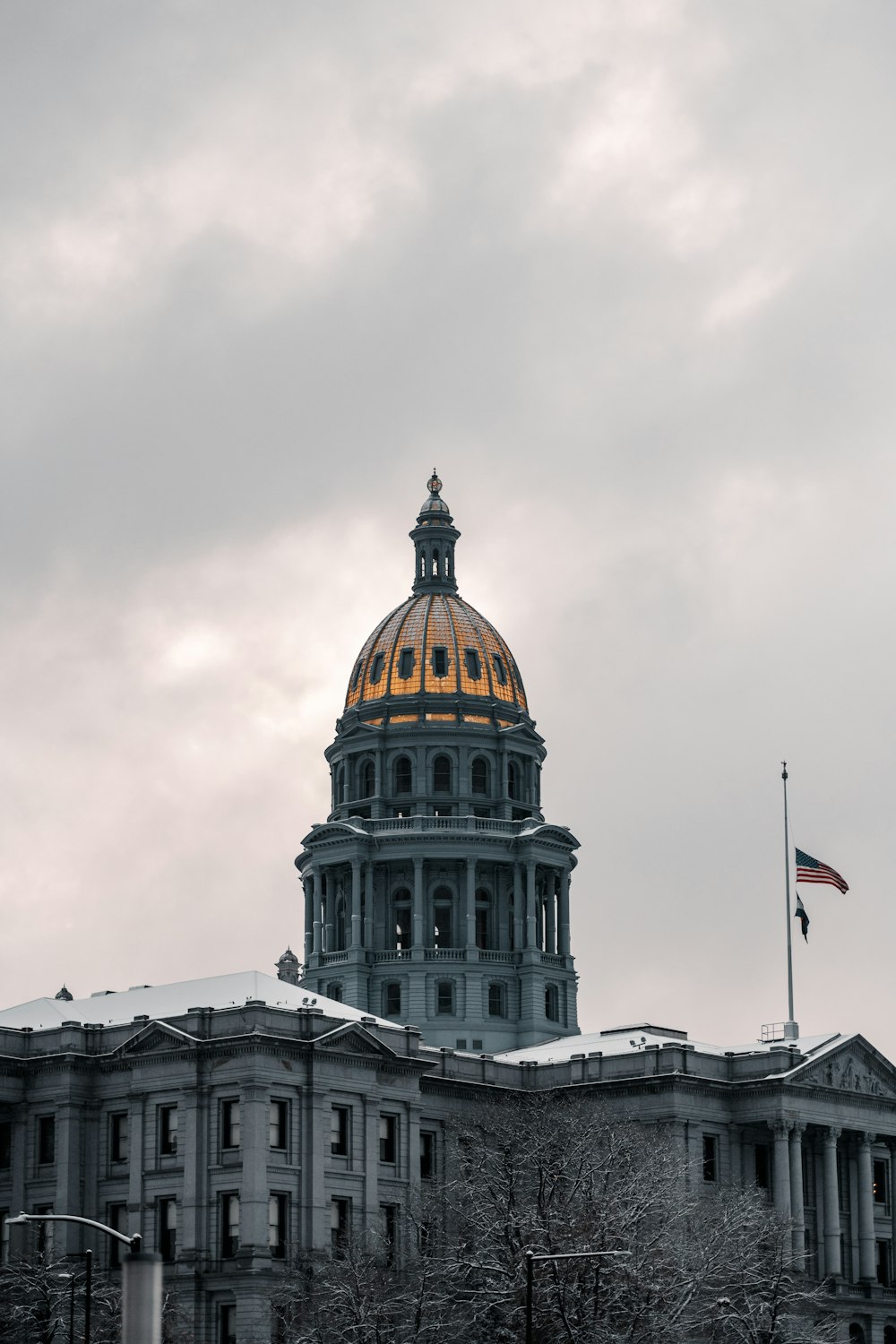 the dome of a building with a flag on top