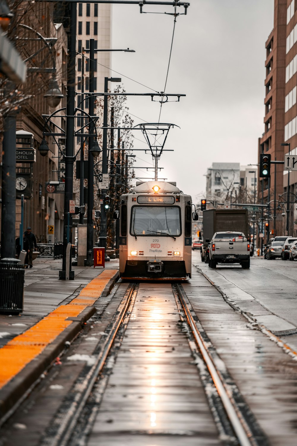 a train on a track in the middle of a city