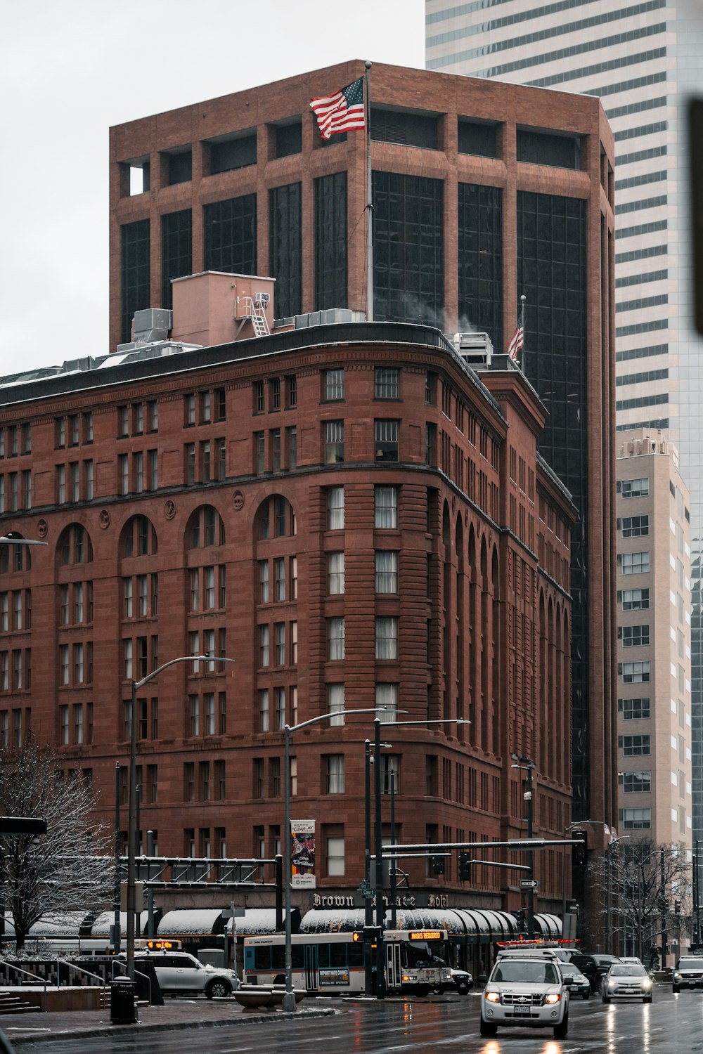 a red brick building with a flag on top of it