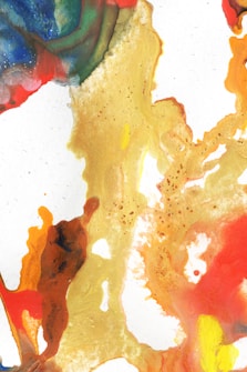 A vibrant abstract painting with swirling patterns of blue, green, red, yellow, orange, and gold hues. The textures vary from smooth to grainy, creating a dynamic visual experience.