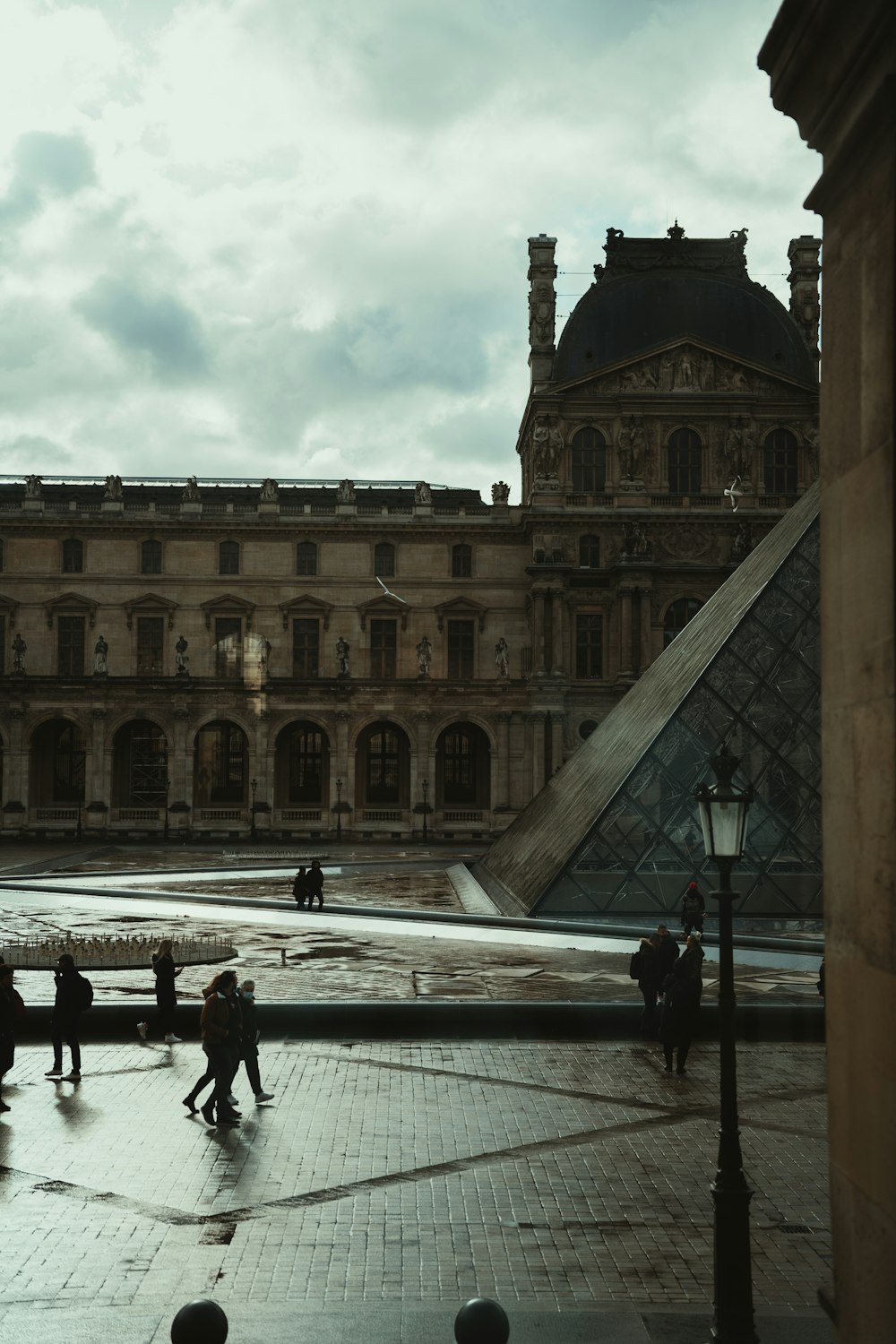 a group of people walking in front of a building