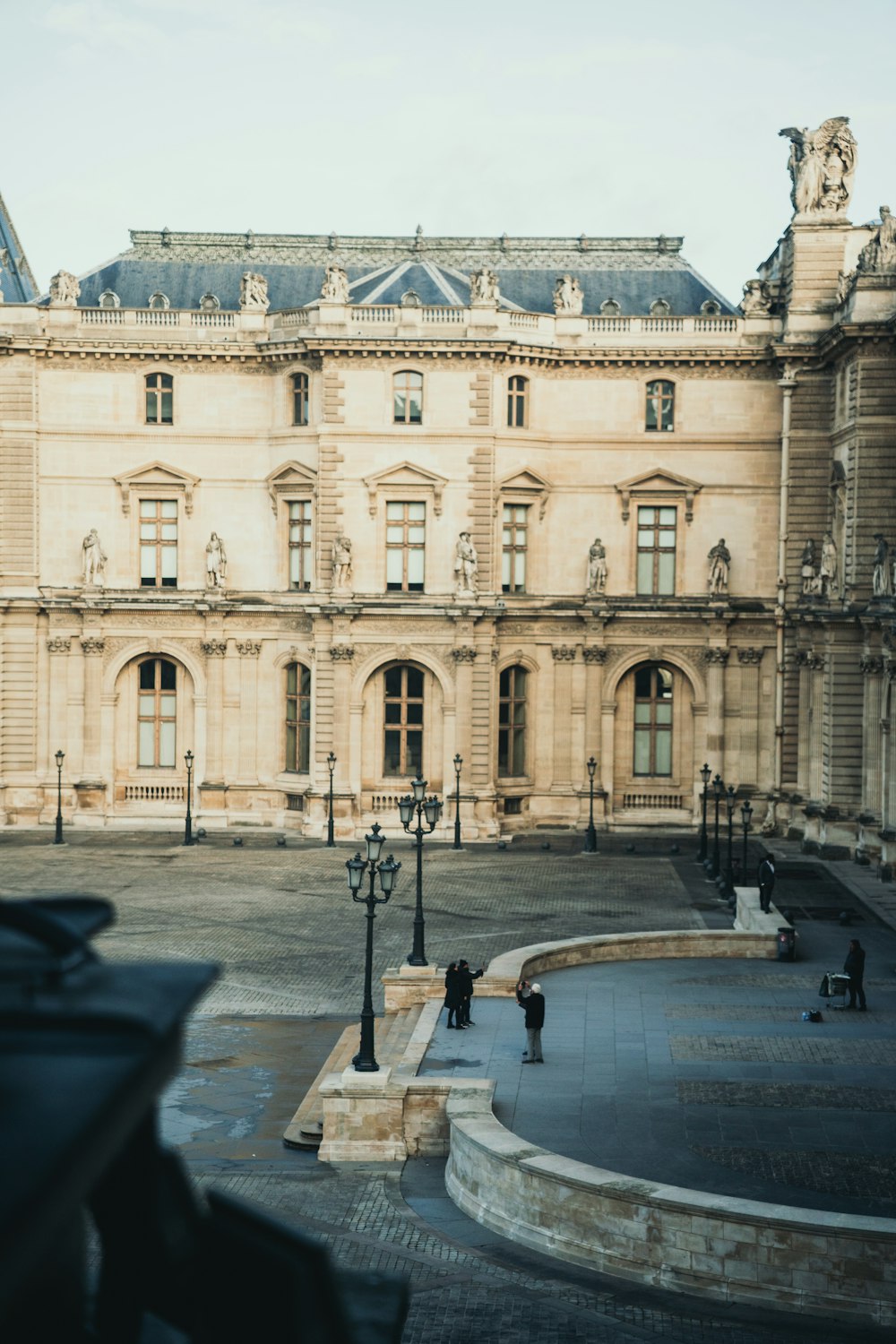 a large building with a fountain in front of it