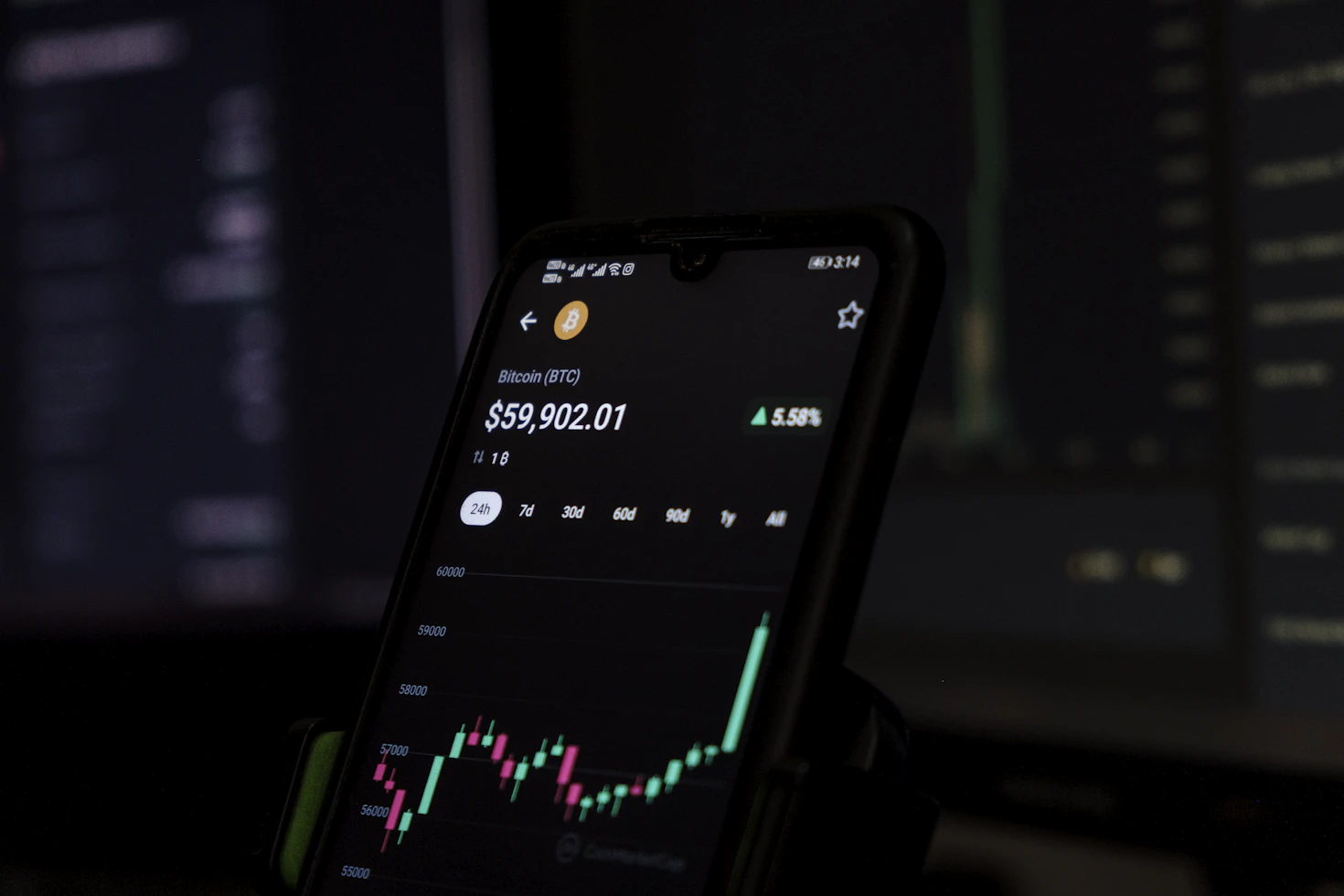 Cryptocurrency market charts on digital screens