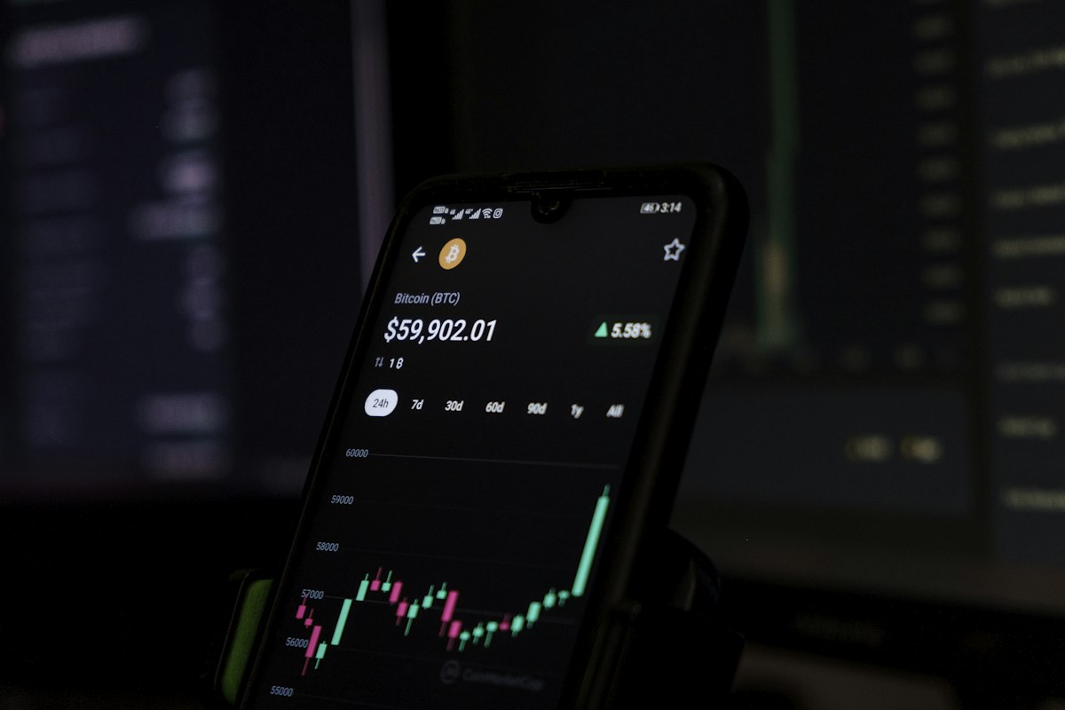 a cell phone displaying a stock chart on the screen