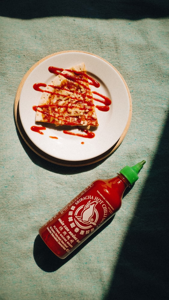 Sriracha poured over