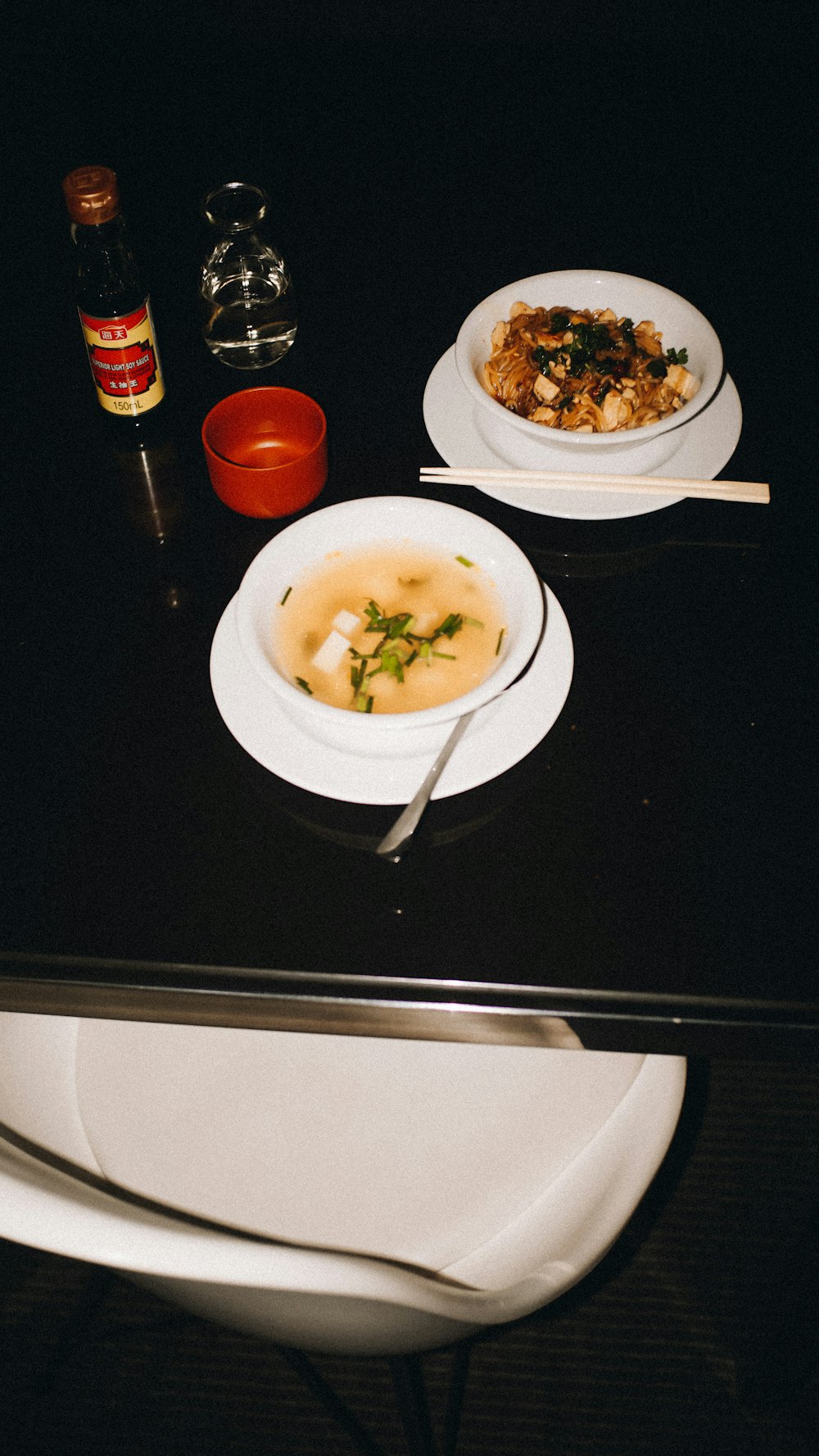 a black table topped with plates of food