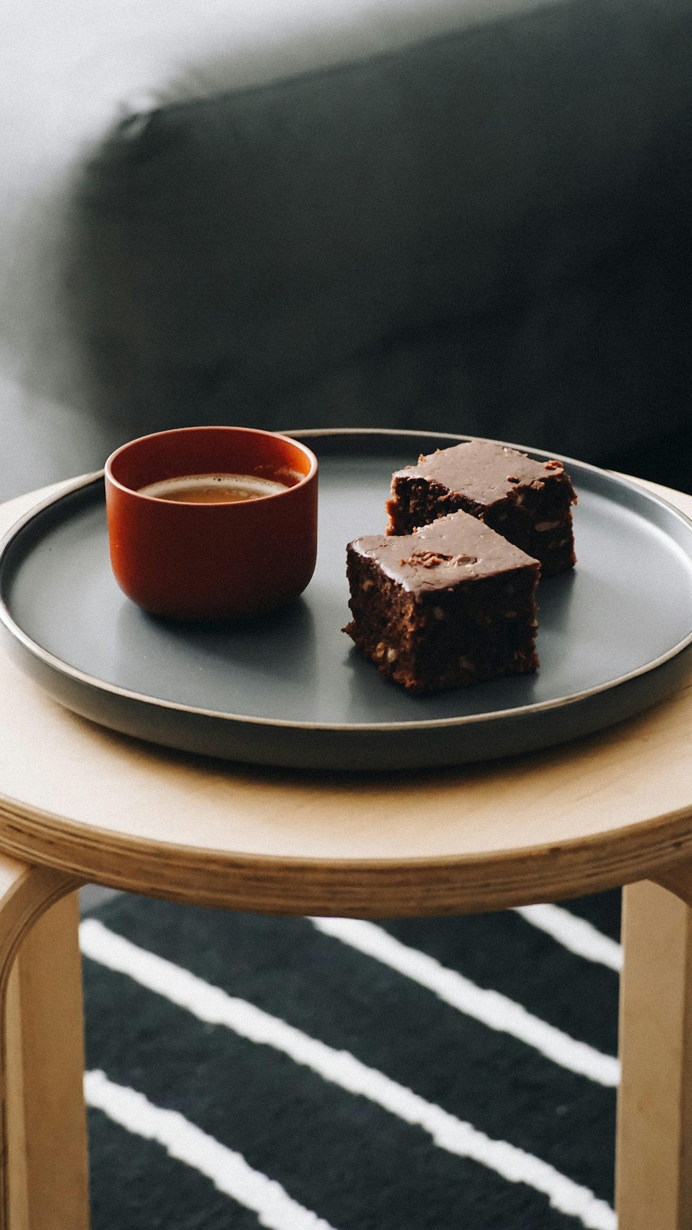 a plate with some brownies and a cup of coffee