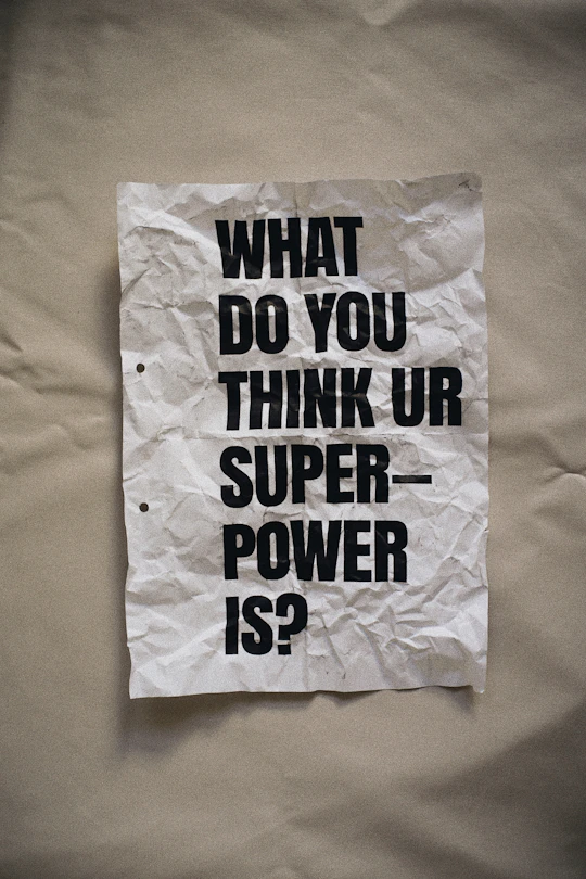 crumpled piece of paper with question on it
