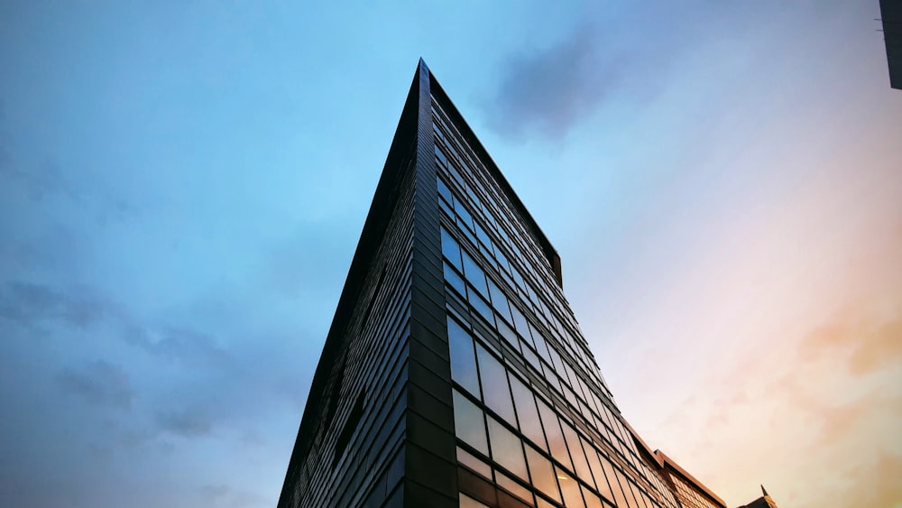 a tall building with a sky in the background