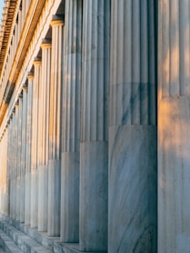 a row of columns on the side of a building