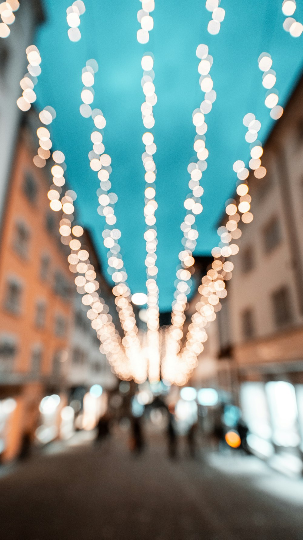 a blurry photo of a street with lights on it