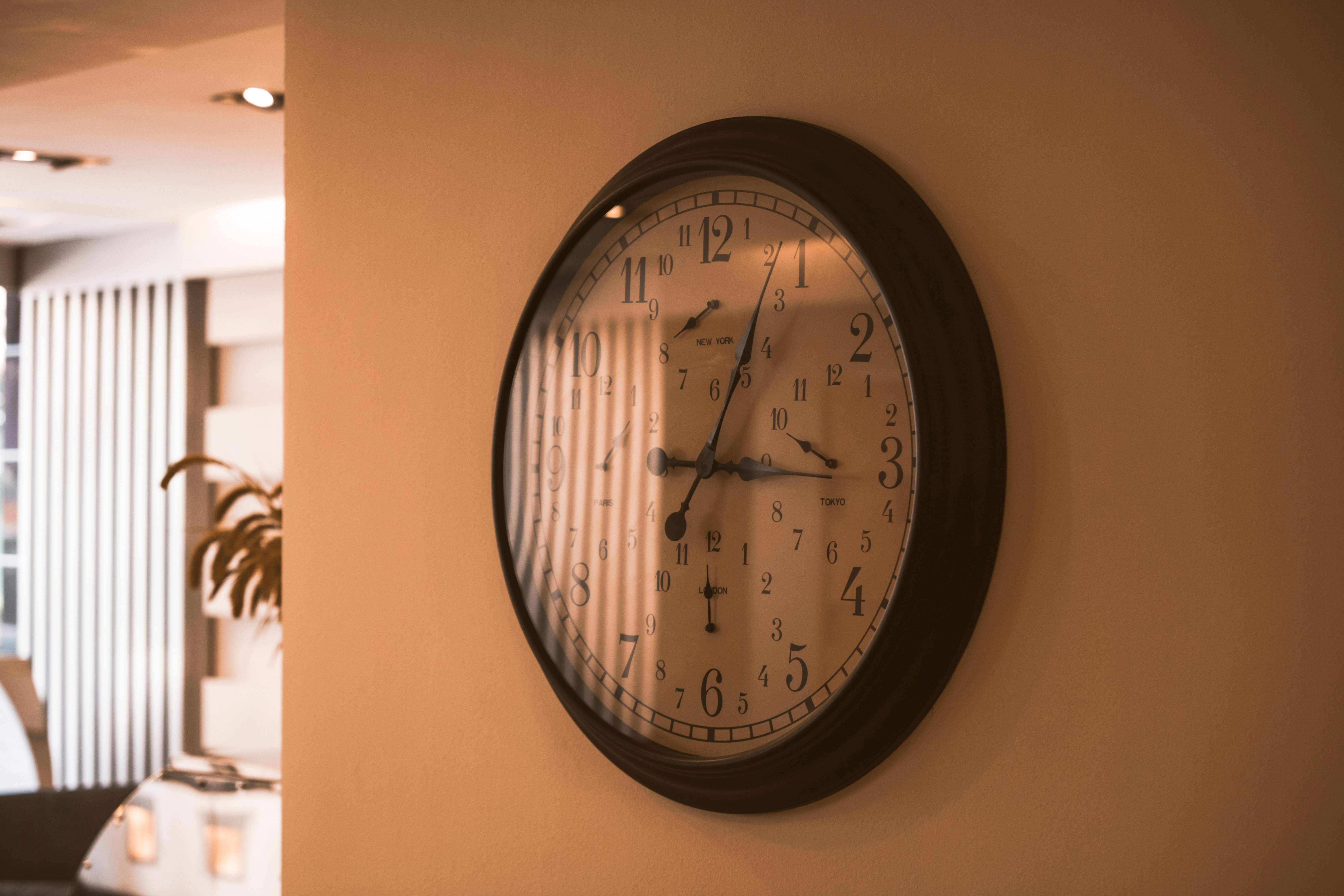 a clock on the wall of a hotel room