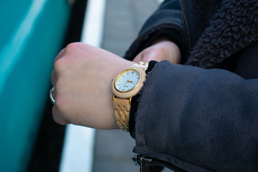 a person wearing a watch on their wrist