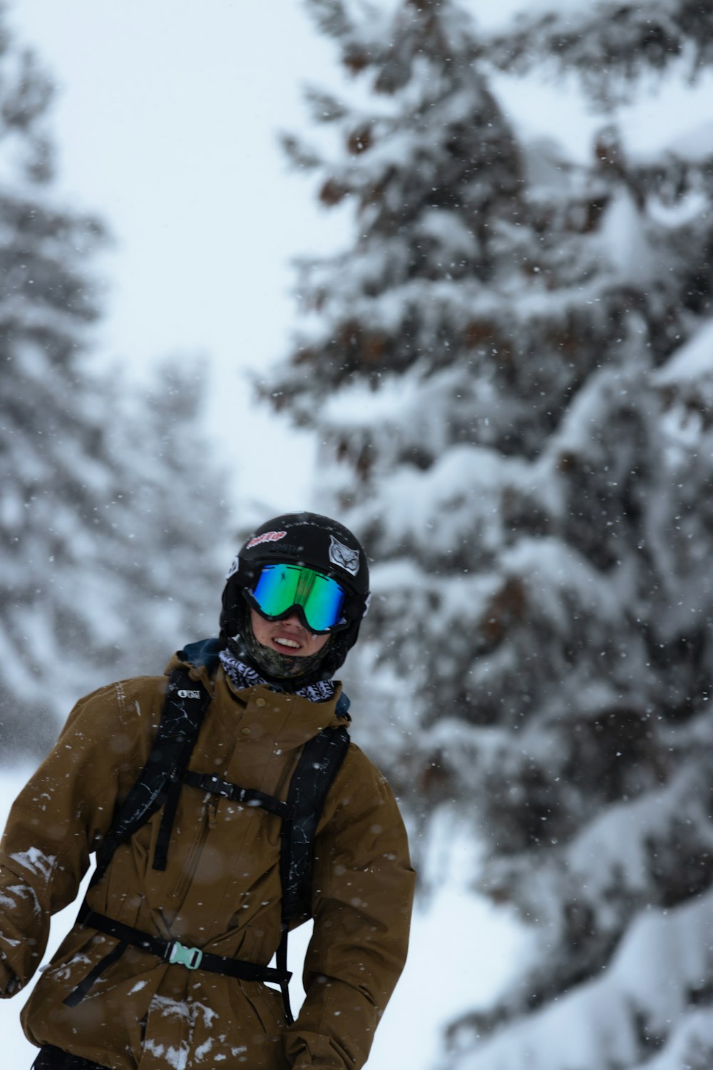 a man riding skis down a snow covered slope