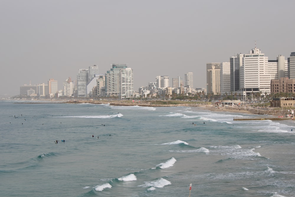 a view of a beach with buildings in the background