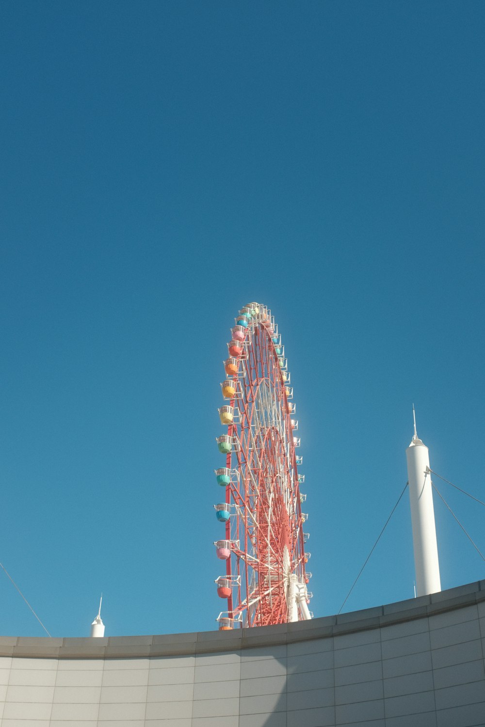 a large ferris wheel on top of a building