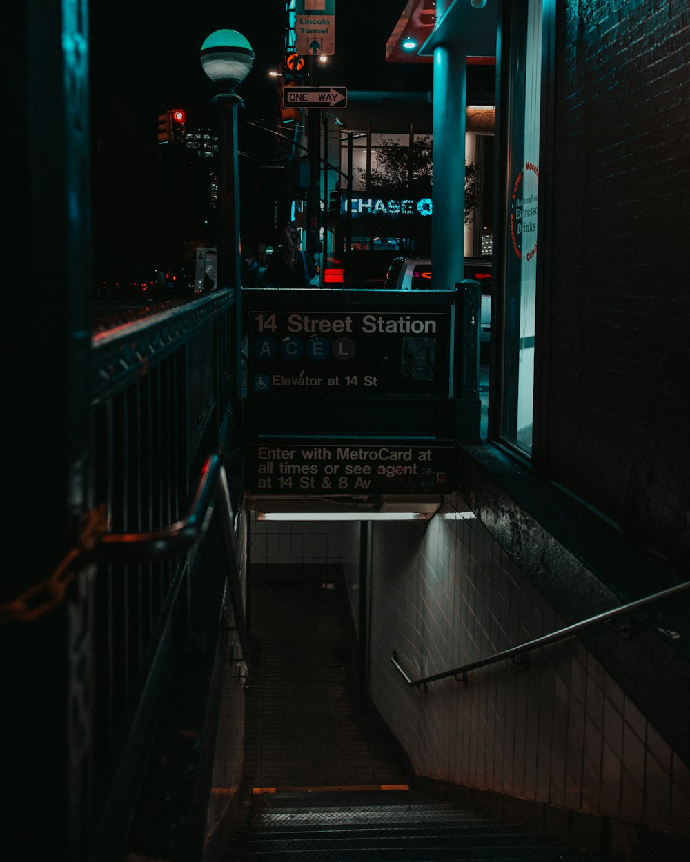 a set of stairs leading up to a street station