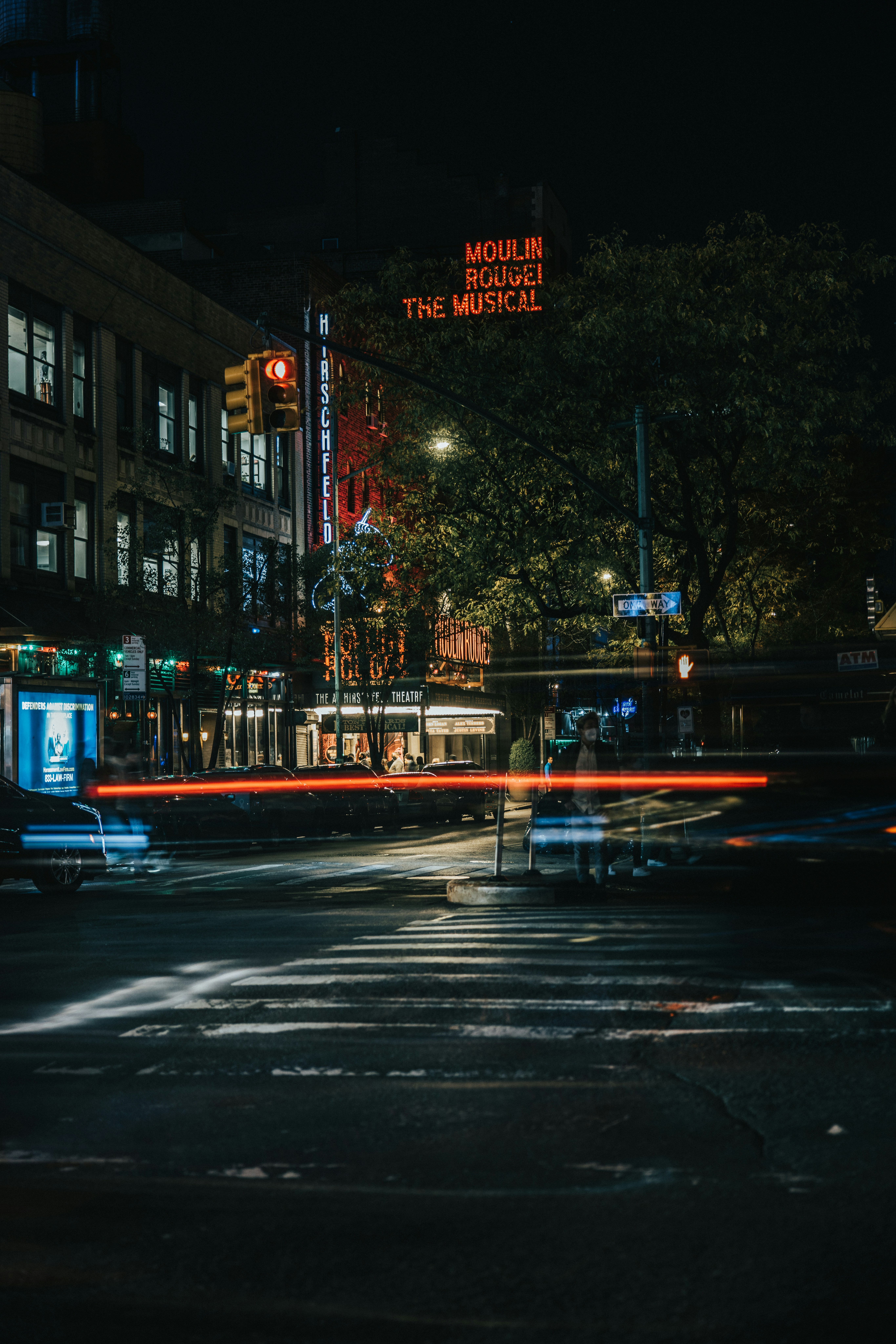 A city street at night with traffic lights photo – Free 7th avenue ...