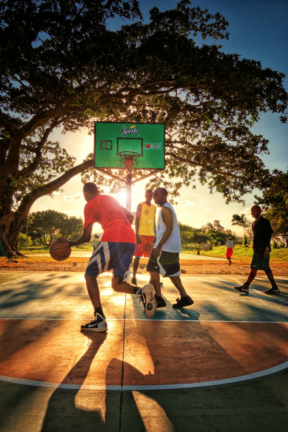 a group of young men playing a game of basketball