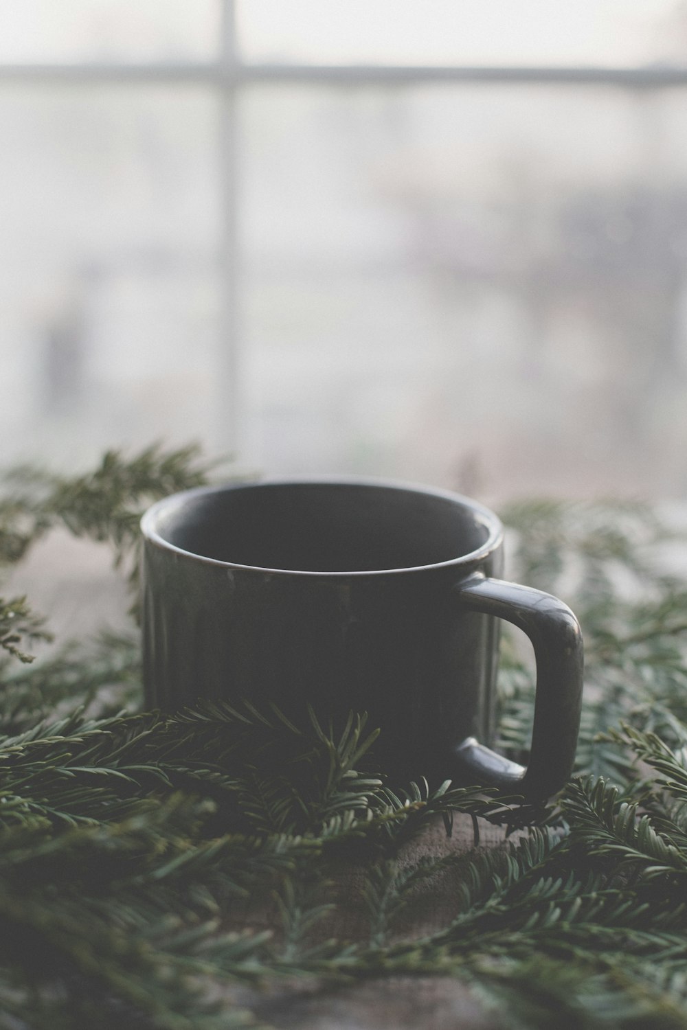 a cup of coffee sitting on top of a table