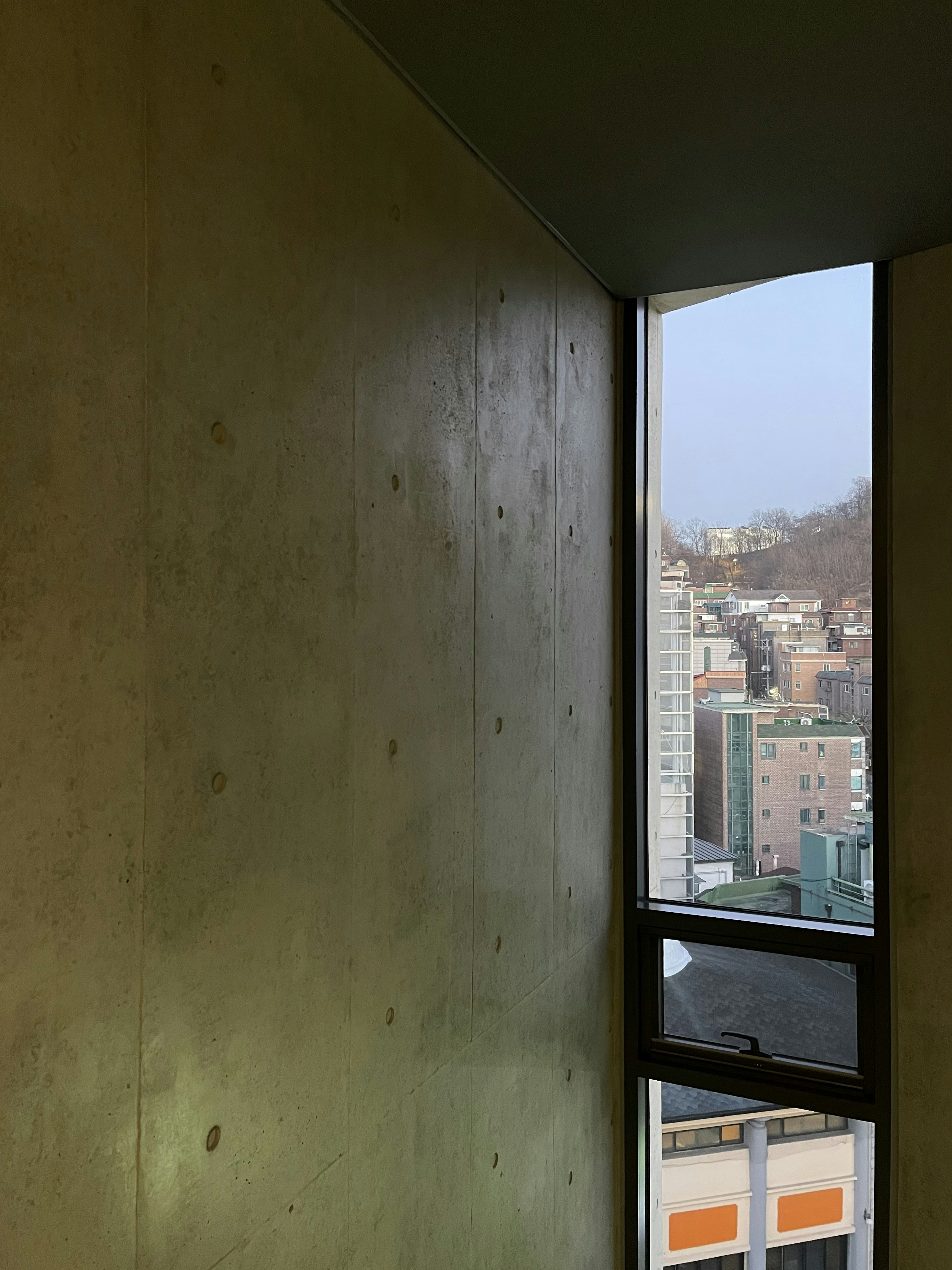 A window with a view of a city photo – Free Building Image on Unsplash