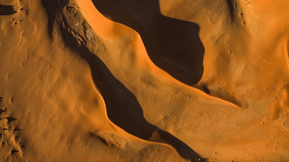 an aerial view of a desert with sand dunes