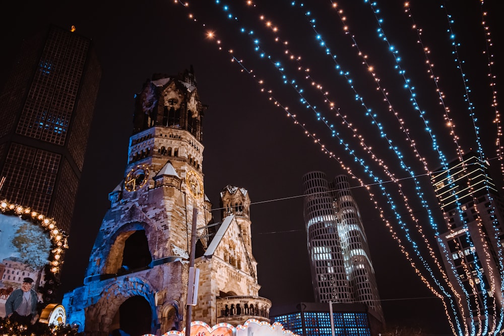 a very tall tower with a clock on it's side