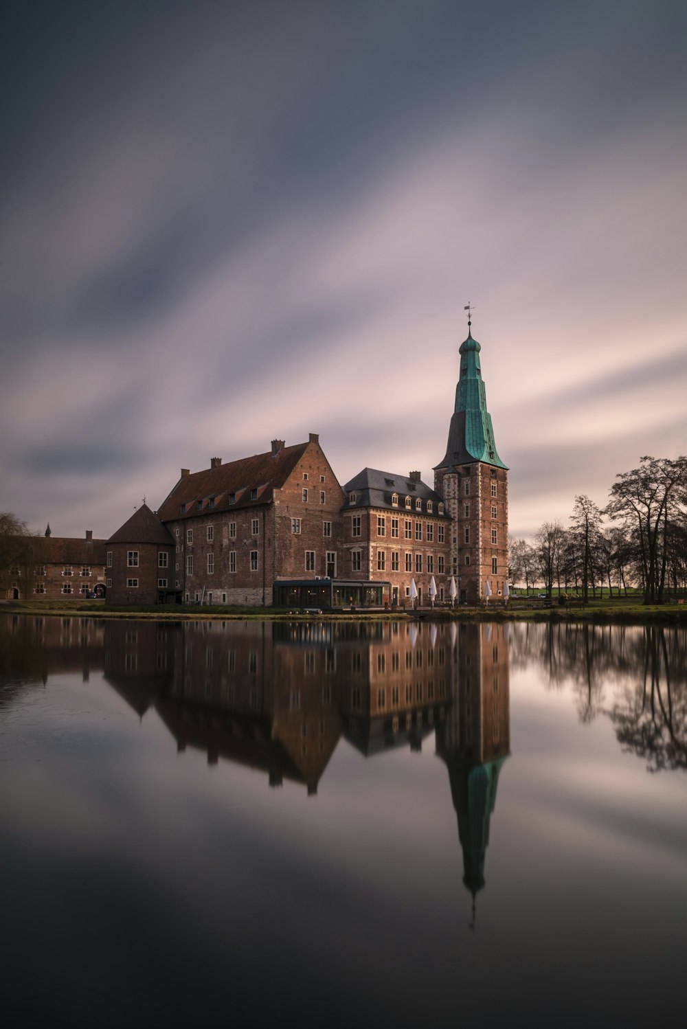 a large building sitting on top of a lake