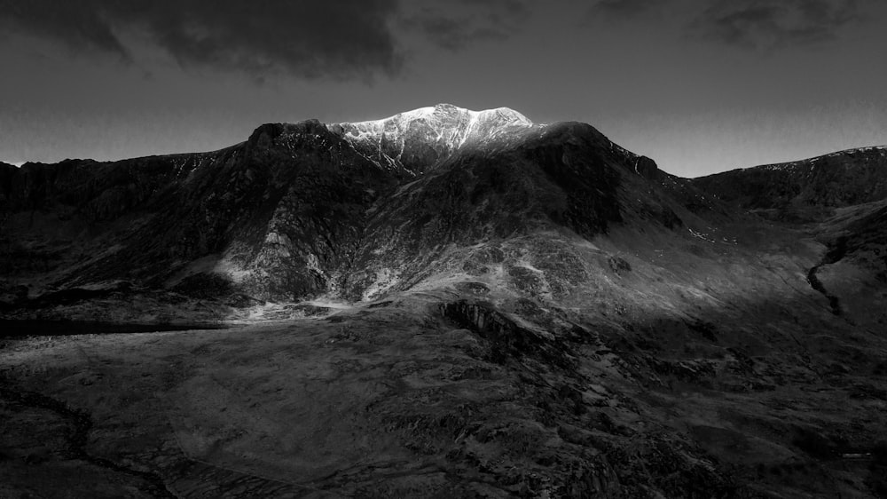 a black and white photo of a mountain