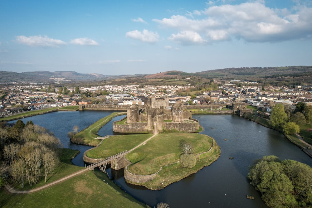 an aerial view of a castle and a river