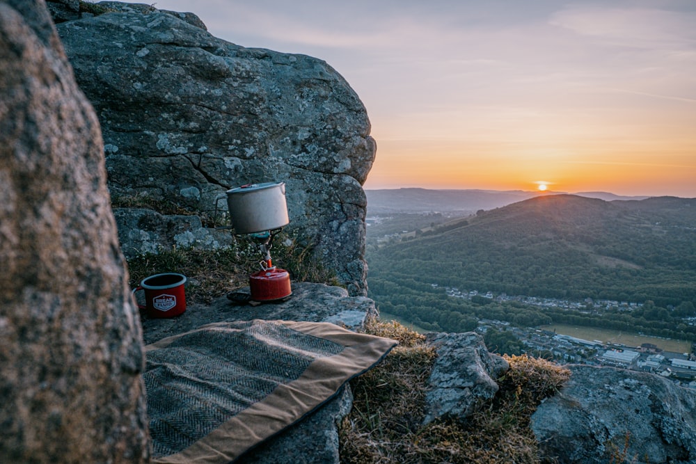 a table with a lamp on top of a mountain