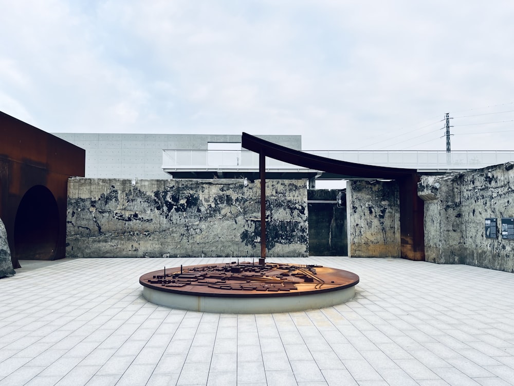 a courtyard with a clock in the middle of it