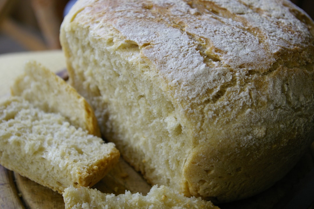 a loaf of bread sitting on top of a plate, Handmade peasant bread