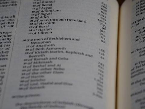 Old handwritten genealogical records spread out on a wooden table.